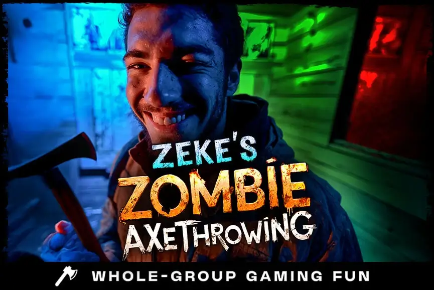 Smiling survivor brandishing axe for Zeke’s Zombie Axe Throwing game at Bayville.